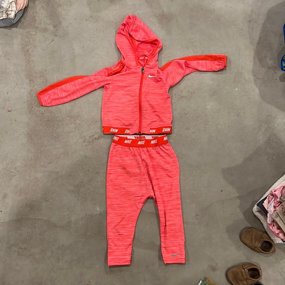 Nike Dri-fit track suit. Kind of a salmon pink or orange/red color. 24month.